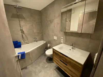 Ein Badezimmer in der Unterkunft Luxuriöses Ferienapartment A2 mit umzäunten Garten, 55qm
