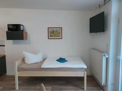 Ein Bett oder Betten in einem Zimmer der Unterkunft City Pension Senftenberg / Apartment Nr.1