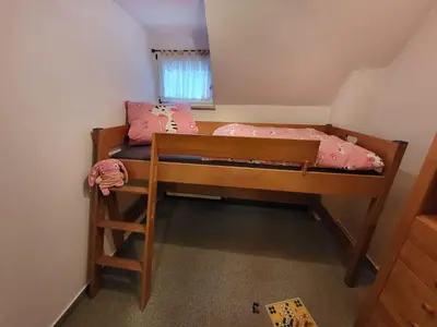 Ein Bett oder Betten in einem Zimmer der Unterkunft Ferienhaus Sonnenblick Schmilka