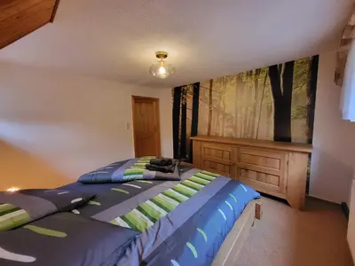 Ein Bett oder Betten in einem Zimmer der Unterkunft Ferienhaus Sonnenblick Schmilka