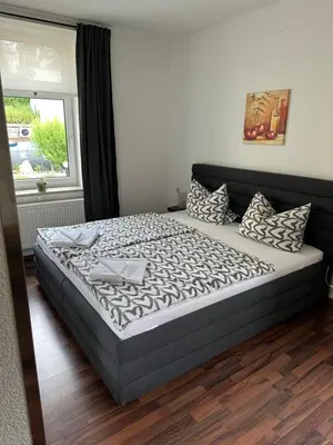 Ein Bett oder Betten in einem Zimmer der Unterkunft Pension Zur Wartburg