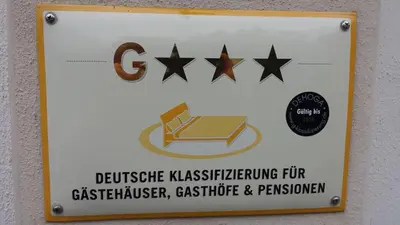 Ein Zertifikat, Auszeichnung, Logo oder anderes Dokument, das in der Unterkunft Pension Zur Wartburg ausgestellt ist