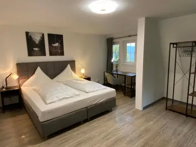 Ein Bett oder Betten in einem Zimmer der Unterkunft Kavaliershaus neben Schloss Rauenstein