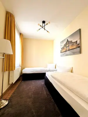 Ein Bett oder Betten in einem Zimmer der Unterkunft Familienapartment Münzgasse mit Blick zur Frauenkirche