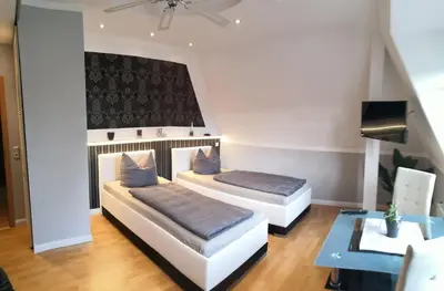 Ein Bett oder Betten in einem Zimmer der Unterkunft Pension&Wellness-Oase-Nossen