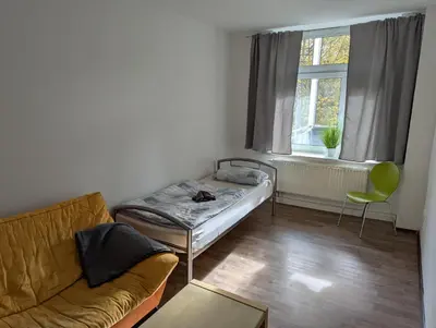 Ein Bett oder Betten in einem Zimmer der Unterkunft Arbeiterwohnung