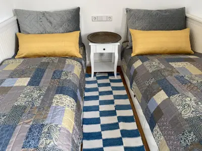 Ein Bett oder Betten in einem Zimmer der Unterkunft Ferienwohnungen im Gästehaus der Villa Wilisch