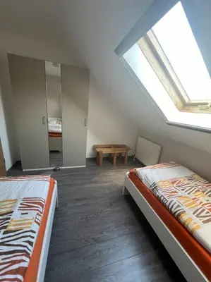 Ein Bett oder Betten in einem Zimmer der Unterkunft Schöne Ferienwohnung im Grünen
