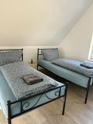 Ein Bett oder Betten in einem Zimmer der Unterkunft Ferienhaus Wachwitzgrund