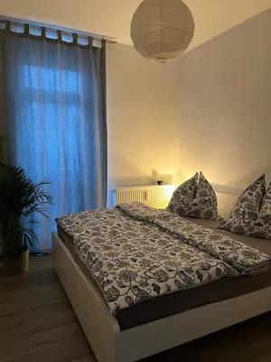 Ein Bett oder Betten in einem Zimmer der Unterkunft Bergstadtwohnung