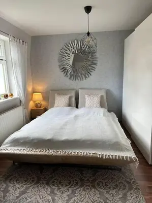 Ein Bett oder Betten in einem Zimmer der Unterkunft Charmantes Zimmer in Dresden OT Langebrück