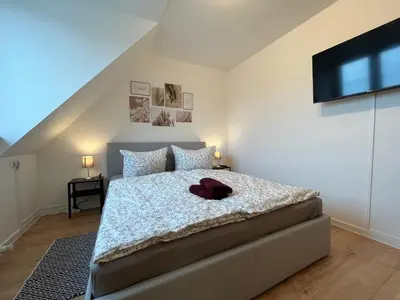Ein Bett oder Betten in einem Zimmer der Unterkunft Wohnperle*WindbergBlick*ruhig