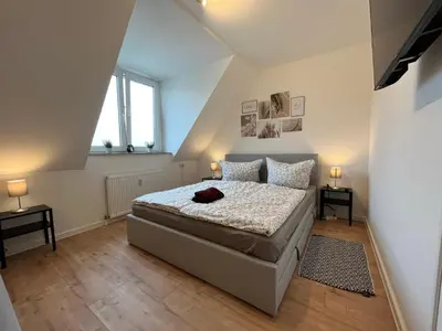Ein Bett oder Betten in einem Zimmer der Unterkunft Wohnperle*WindbergBlick*ruhig
