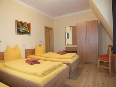 Ein Bett oder Betten in einem Zimmer der Unterkunft Pension am Elberadweg