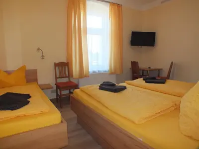 Ein Bett oder Betten in einem Zimmer der Unterkunft Pension am Elberadweg