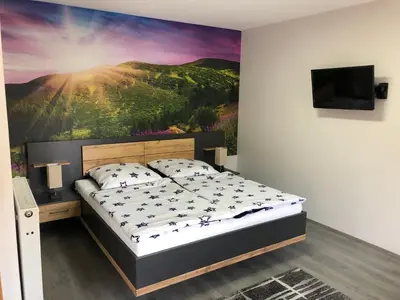 Ein Bett oder Betten in einem Zimmer der Unterkunft Pension am See