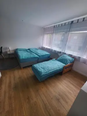 Ein Bett oder Betten in einem Zimmer der Unterkunft FeWo-Misterek nähe Großer Garten