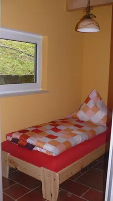 Ein Bett oder Betten in einem Zimmer der Unterkunft Ferienhaus am Sonnenhang