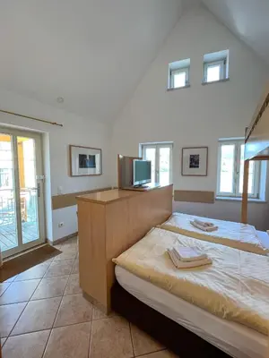 Ein Bett oder Betten in einem Zimmer der Unterkunft Fährhaus Helios (ehem. Fährhaus Hesse)