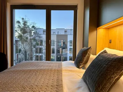 Ein Bett oder Betten in einem Zimmer der Unterkunft Townhouse Alaunpark