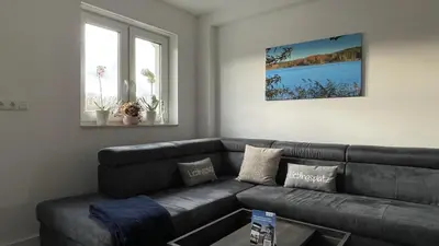 Ein Sitzbereich in der Unterkunft Ferienhaus Helfert FeWo2 mit eigener Terrasse