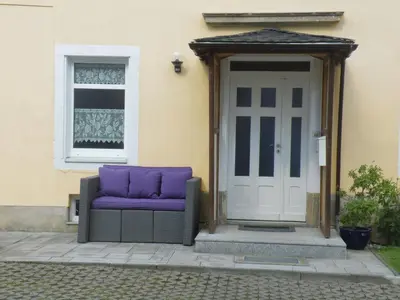 Ein Sitzbereich in der Unterkunft Ferienwohnung Am Lindenbaum