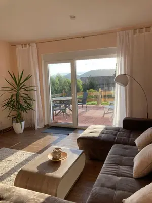 Ein Sitzbereich in der Unterkunft Landhaus Böhmer, Ferienhaus Schrammsteinblick