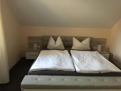 Ein Bett oder Betten in einem Zimmer der Unterkunft Landhaus Böhmer, Ferienhaus Schrammsteinblick