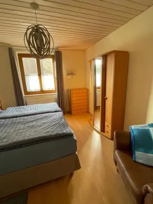 Ein Bett oder Betten in einem Zimmer der Unterkunft Ferienwohnung Schneider