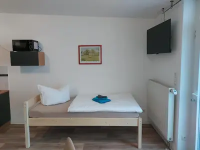Ein Bett oder Betten in einem Zimmer der Unterkunft City-Pension Senftenberg / Apartment Nr. 3