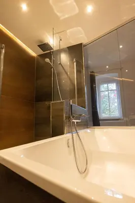 Ein Badezimmer in der Unterkunft Loft Apartment mit großer Badewanne B
