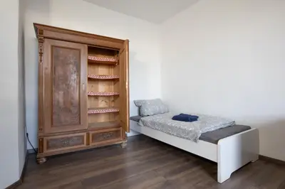 Ein Bett oder Betten in einem Zimmer der Unterkunft Urige Wohnung mit zwei Betten und genialer Küche