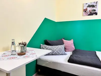 Ein Bett oder Betten in einem Zimmer der Unterkunft Pension am Plan