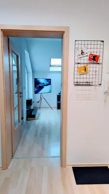 Ein Bett oder Betten in einem Zimmer der Unterkunft Rooftop Art Apartment, E-Roller,Ausblick,WLAN,TV, Netflix
