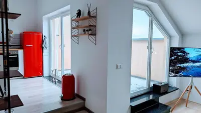 Ein Bett oder Betten in einem Zimmer der Unterkunft Rooftop Art Apartment, E-Roller,Ausblick,WLAN,TV, Netflix