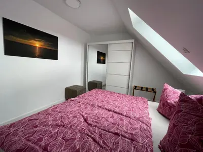 Ein Bett oder Betten in einem Zimmer der Unterkunft Ferienhaus Helfert Fewo DG mit Terrasse