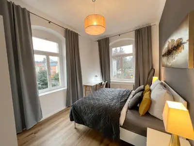 Ein Bett oder Betten in einem Zimmer der Unterkunft Wohnung in Radebeul