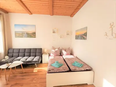 Ein Bett oder Betten in einem Zimmer der Unterkunft R1 - Urlaubsmagie - Bad Schandau fußläufig, Garten