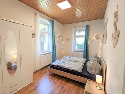 Ein Bett oder Betten in einem Zimmer der Unterkunft R1 - Urlaubsmagie - Bad Schandau fußläufig, Garten