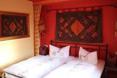 Ein Bett oder Betten in einem Zimmer der Unterkunft Waldhaus Colditz Garni