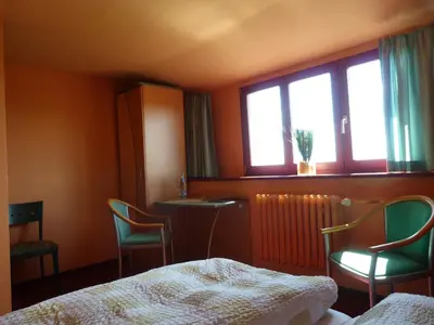 Ein Bett oder Betten in einem Zimmer der Unterkunft Waldhaus Colditz Garni