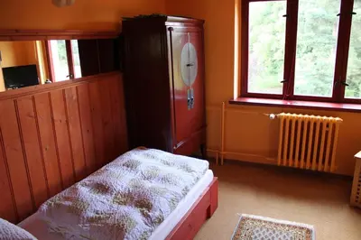 Ein Bett oder Betten in einem Zimmer der Unterkunft Waldhaus Colditz Garni