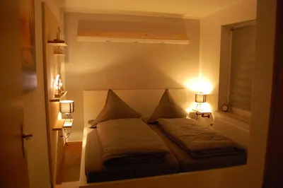 Ein Bett oder Betten in einem Zimmer der Unterkunft Ferienwohnung Pobershau