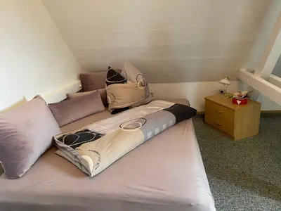 Ein Bett oder Betten in einem Zimmer der Unterkunft Ferienwohnung 