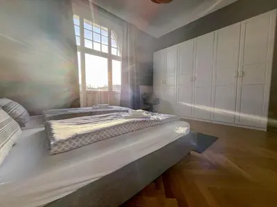 Ein Bett oder Betten in einem Zimmer der Unterkunft Wohnperle*GroßerGarten*Villa