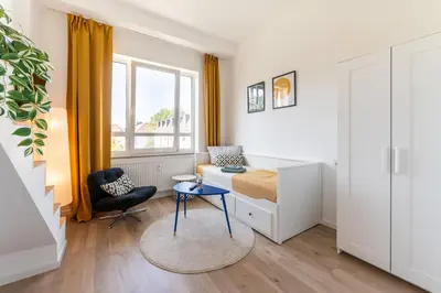 Ein Sitzbereich in der Unterkunft D52 - DAS BUSINESSAPARTMENT --- 2 Minuten vom Flughafen entfernt