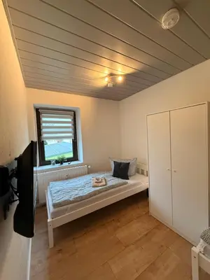 Ein Bett oder Betten in einem Zimmer der Unterkunft Mikro Apartment Großenhain