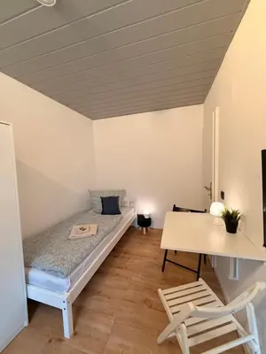Ein Bett oder Betten in einem Zimmer der Unterkunft Mikro Apartment Großenhain