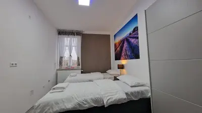 Ein Bett oder Betten in einem Zimmer der Unterkunft CT Apartment Wurzen