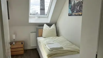 Ein Bett oder Betten in einem Zimmer der Unterkunft Schönherrstrasse